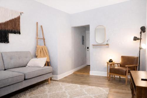 a living room with a couch and a table at Downtown Gem • King Bed • Fast WIFI in Salt Lake City