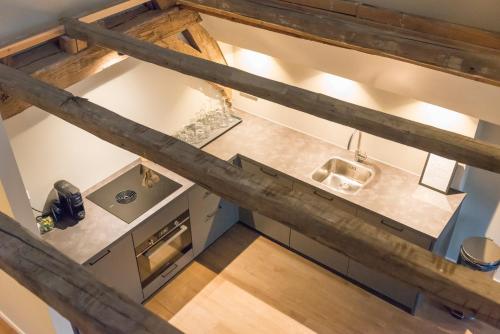 an overhead view of a kitchen from above at House of De Swaen Apartments in Breda