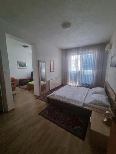 a bedroom with a large bed in a room at Hotel Split in Usora
