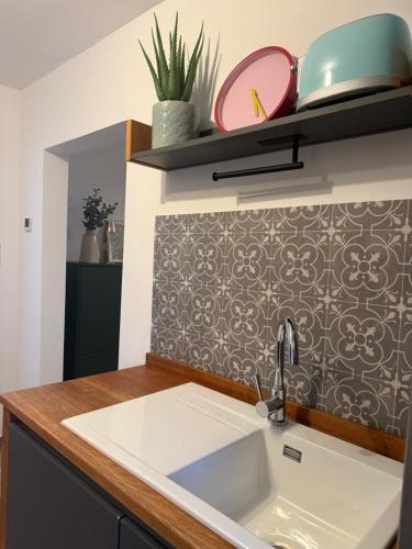 a kitchen with a sink and a counter top at Q80 Appartement in Schermbeck