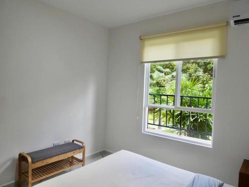 a bedroom with a bed and a window at NEW! Jungle Chic Retreat in Aldea Tulum in Tulum