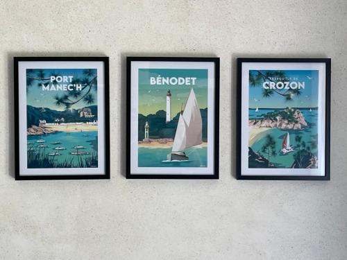four framed posters hanging on a wall at La Chambre Bleue in Quimper