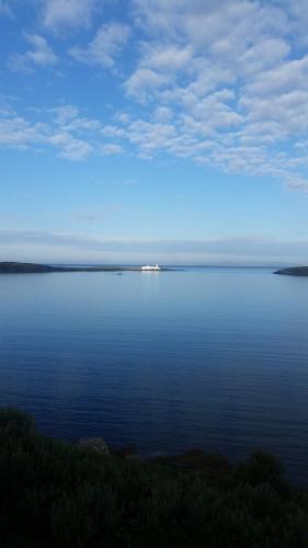 a boat in the middle of a large body of water at Horizon View Lodge Bed and Breakfast Glanleam Road Knightstown Valentia Island County Kerry V23 W447 Ireland in Valentia Island