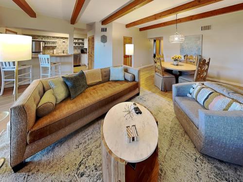 a living room with a couch and a table at Casa Cielo in Santa Fe