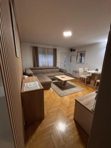 a living room with a couch and a table at Apartment Elize in Zagreb