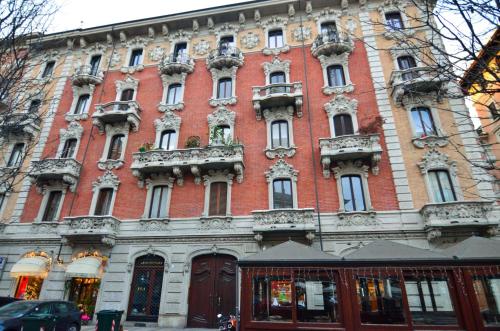 a large red brick building with lots of windows at Cà dla Madamina in Turin