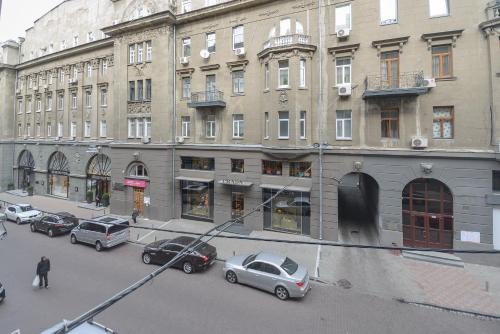 a group of cars parked in front of a building at Partner Guest House Khreschatyk in Kyiv