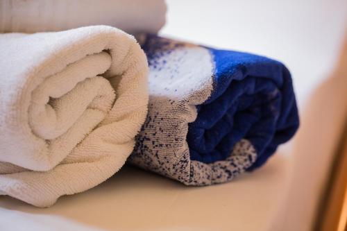a couple of towels sitting next to each other at Garbis Villas & Apartments in Lourdata