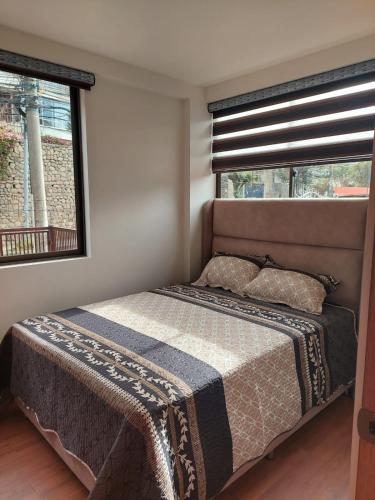 Llit o llits en una habitació de Confortable Apartament