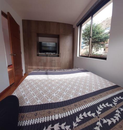 Katil atau katil-katil dalam bilik di Confortable Apartament