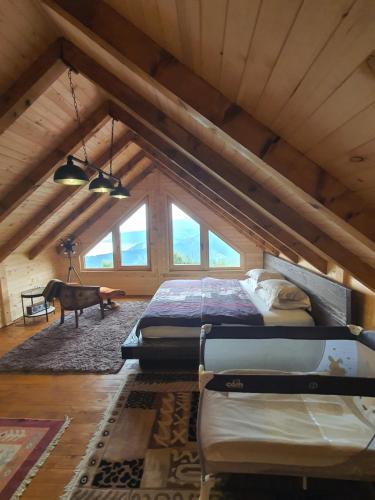 a bedroom with two beds in a attic at Villa Skyline in Kotor