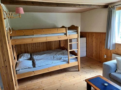 a bedroom with two bunk beds in a room at Urlaub im Elchland in Letafors