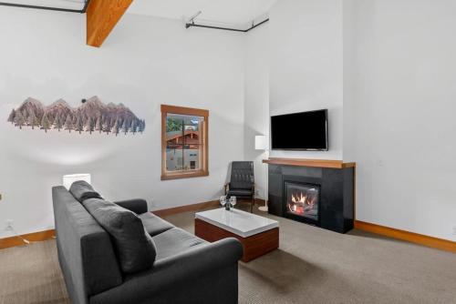 a living room with a couch and a fireplace at Valhalla - Pacific Retreats in Leavenworth