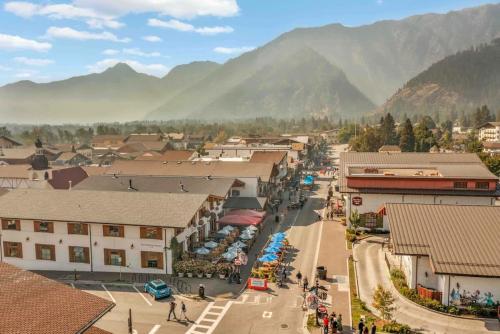 an aerial view of a town with mountains in the background at Front Street Suites - Pacific Retreats in Leavenworth