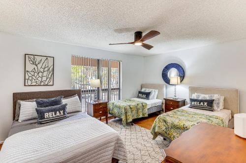 a bedroom with two beds and a ceiling fan at Condo in PGA National Resort w/ Pool & Spa! in Palm Beach Gardens