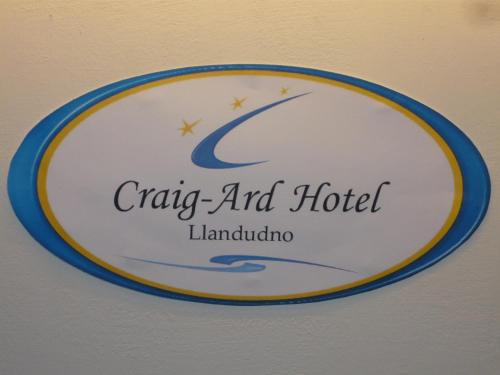 a sign for a cabaq and hotel lamolulu at Craig-Ard Hotel in Llandudno