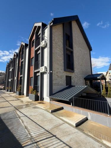 aartment building with a solarium on the side of it at The Watermill Lodge in Kolašin