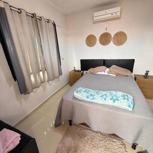 a bedroom with a bed with a pillow on it at Sertão beach in Tutóia