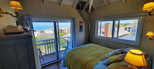 Llit o llits en una habitació de LAS ESCAMADAS ecocottage