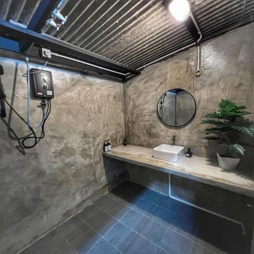 a bathroom with a sink and a mirror at A6886 Swimming Pool Villa in Kuantan