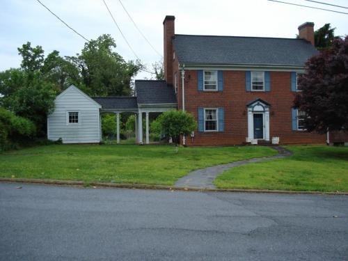 a red brick house with a grass yard at Welcome to your private cozy room #2 near LU, Stadium & general hospital in Lynchburg