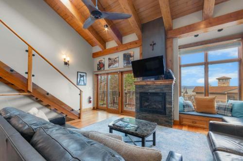a living room with a couch and a fireplace at Aspen Edge Lakefront and Loft in South Lake Tahoe