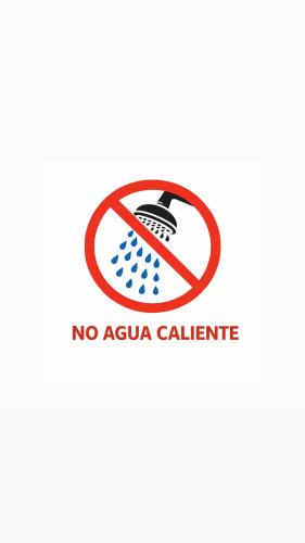 a sign that reads no extra californium at Lorenzo Hotel in San Salvador