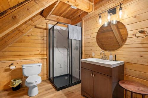 a bathroom with a toilet and a shower at The Hailey Cabin in Island Park