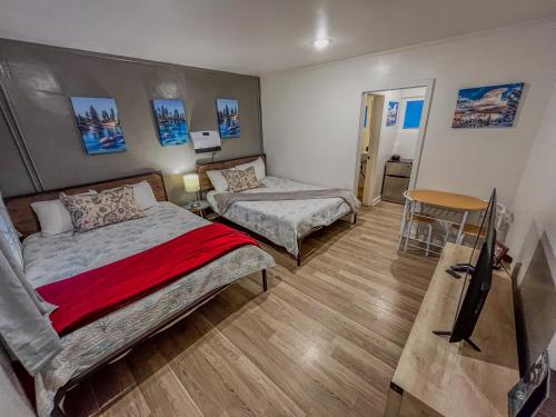 a hotel room with two beds and a table at The Chalet at Kings Beach Unit 3 in Kings Beach
