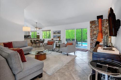 a living room with a couch and a table at Alejo Olive Orchard - Alice Lodging in Palm Springs