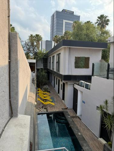 a balcony of a building with a swimming pool at Adhoc Boutique Barrio Antiguo in Monterrey