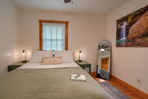a bedroom with a large bed and a window at Havenwood in Logan