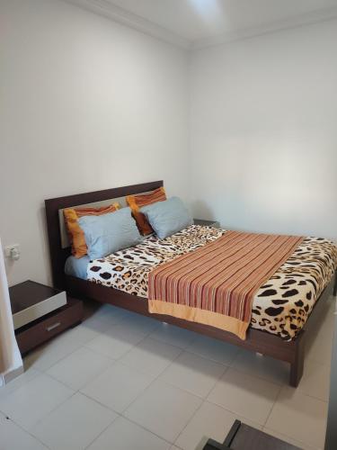 a bedroom with a bed with a leopard at L'Ambre in Hammamet