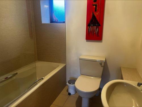 a bathroom with a toilet and a tub and a sink at Cunningair, Kirkwall, Orkney - OR00447F in Kirkwall