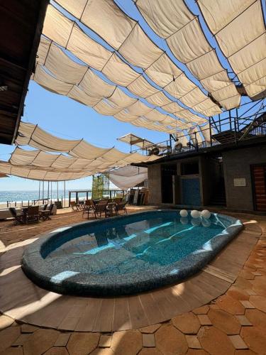 Kolam renang di atau dekat dengan HOTEL EXTASIS ZIPOLITE nudista en zona de fiesta