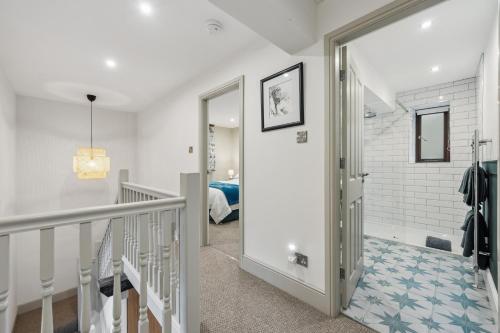 a hallway with a staircase leading to a bedroom at The Forge in Castleton