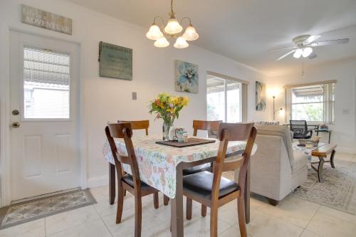 a dining room and living room with a table and chairs at 2 Mi to Boardwalk Home with Grill in Dania Beach! in Dania Beach