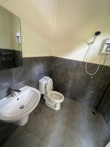 a bathroom with a toilet and a sink and a shower at Mina House in Thong Nai Pan Yai