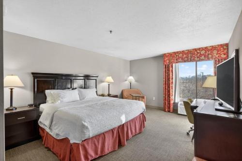 a hotel room with a large bed and a window at Hotel SLC in Salt Lake City