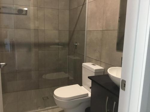 a bathroom with a toilet and a sink at Giulia Guests Rooms in Beechmont