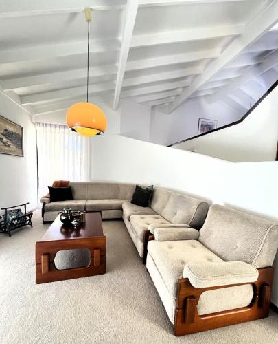 a living room with a couch and a table at 17 Rare Cool Urban-Style Nedlands 4BR-Parkng&Pool in Perth