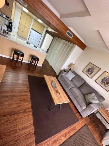 a living room with a couch and a table at 305 On the Beach in Waianae
