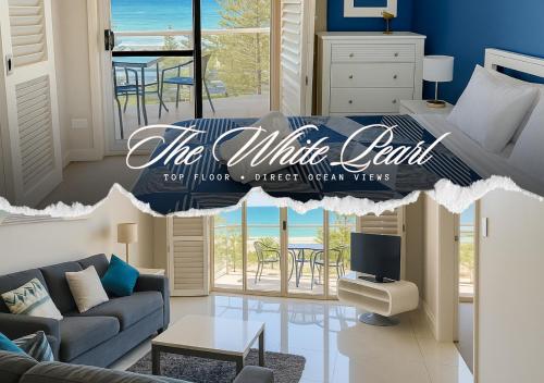 a living room with a couch and a tv at The White Pearl Apartment Direct Ocean Views Top Floor in Perth