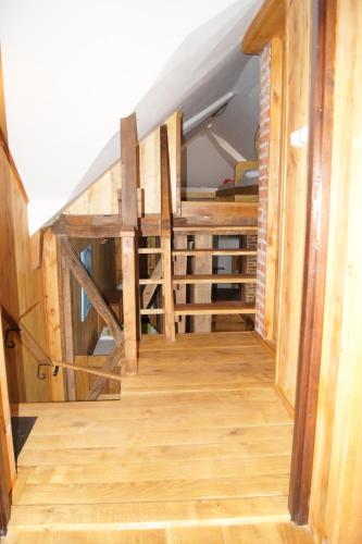 a stairwell in a house with wooden flooring at Guest House Glogovac in Kamenica