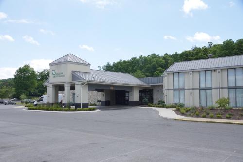 a large building with a parking lot in front of it at Altoona Grand Hotel in Altoona