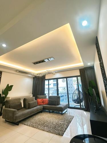 a living room with a couch and a table at 3BR family friendly Apartment at The Elements Ampang Kuala Lumpur in Kuala Lumpur