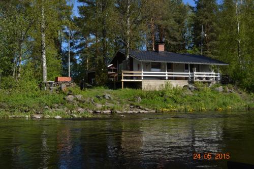 a house on the side of a river at Purolomat in Merikarvia