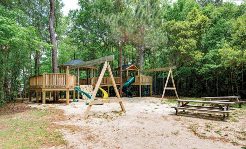 a group of playground equipment in a park at Hilton Vacation Club Beachwoods Kitty Hawk in Kitty Hawk