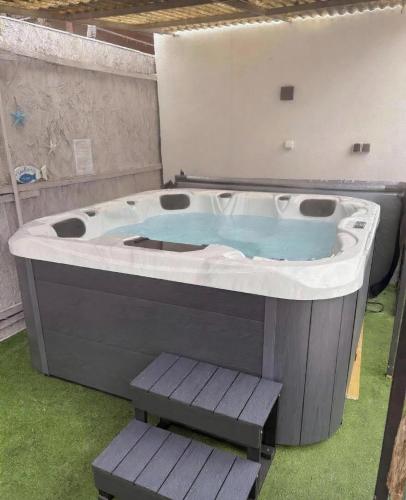 a jacuzzi tub sitting in a room with at Napsugár vendégház in Mezőkövesd
