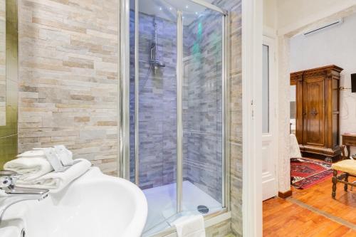 a bathroom with a shower and a sink at Affreschi Su Roma Luxury B&B in Rome
